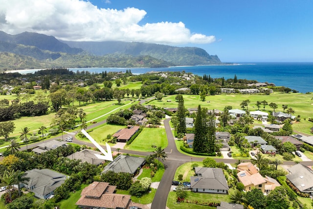 birds eye view of property featuring view of golf course, a residential view, and a water and mountain view