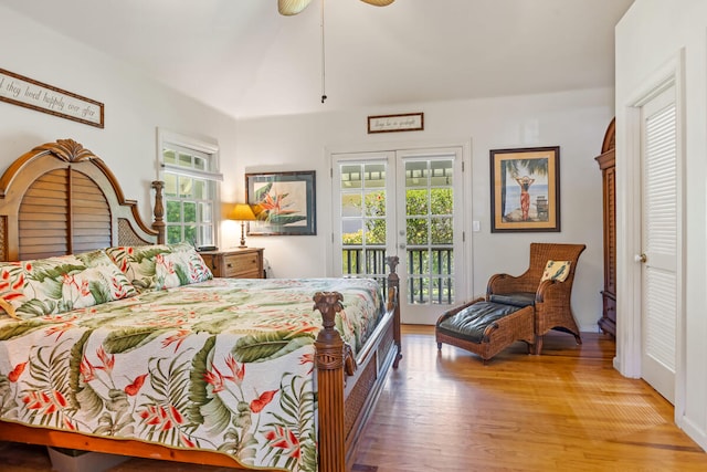 bedroom with access to outside, french doors, ceiling fan, and wood finished floors