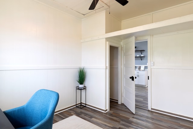 home office featuring a ceiling fan, dark wood-style flooring, and crown molding