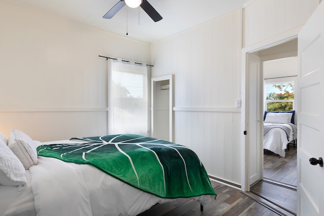 bedroom featuring ceiling fan and wood finished floors