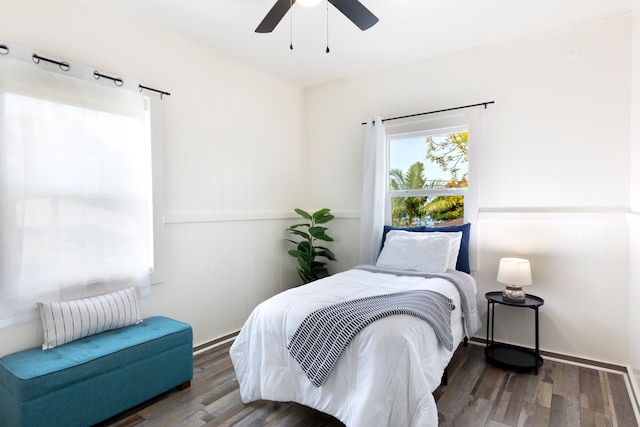 bedroom with ceiling fan and wood finished floors