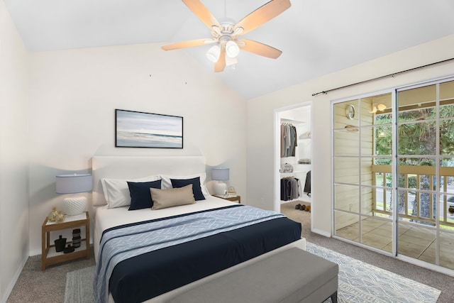 carpeted bedroom featuring baseboards, ceiling fan, access to exterior, a walk in closet, and vaulted ceiling