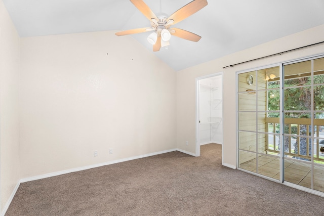 unfurnished room featuring a ceiling fan, lofted ceiling, baseboards, and carpet