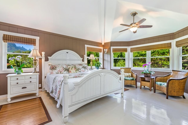 bedroom featuring ceiling fan and high vaulted ceiling