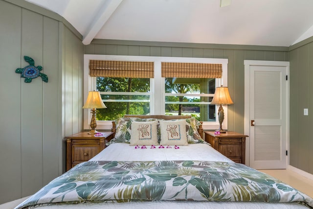 bedroom with vaulted ceiling with beams