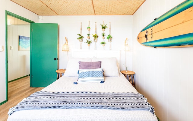 bedroom featuring wood finished floors