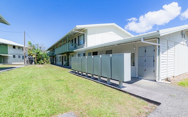 view of side of home featuring a yard