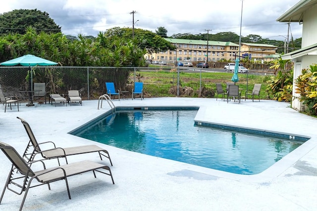 view of pool featuring a patio, fence, and a fenced in pool