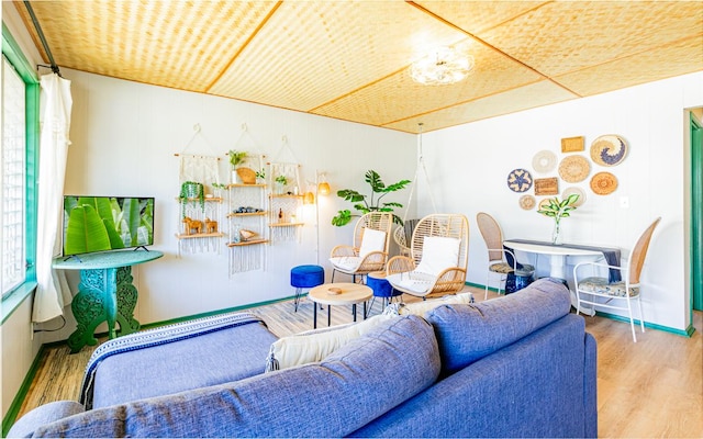 living room featuring baseboards and wood finished floors