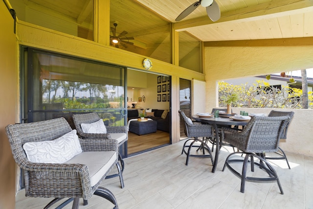 view of patio / terrace featuring outdoor dining area and a ceiling fan