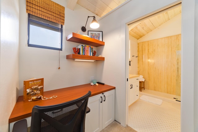 office space with lofted ceiling with beams, built in desk, and wood ceiling