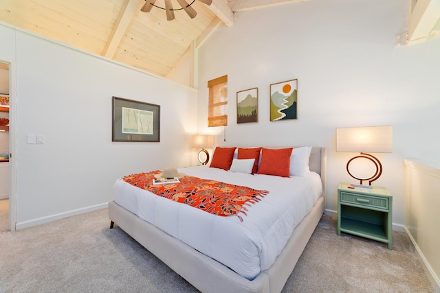 bedroom with carpet floors, wooden ceiling, baseboards, and beamed ceiling