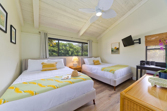 bedroom with vaulted ceiling with beams, wooden ceiling, ceiling fan, and wood finished floors