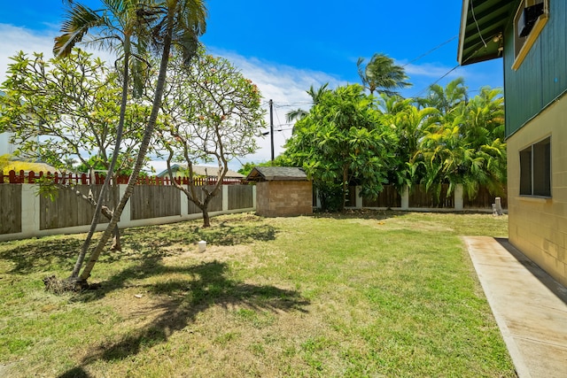 view of yard with a shed and an outbuilding
