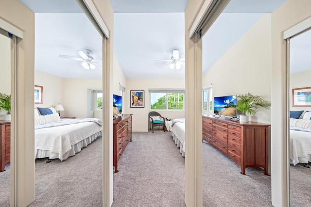 bedroom with light carpet and ceiling fan