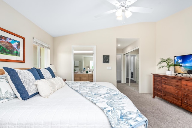 bedroom featuring vaulted ceiling, carpet flooring, a ceiling fan, and ensuite bathroom