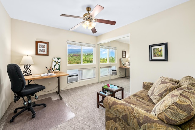 carpeted office space with ceiling fan