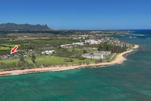 aerial view with a water view and a beach view