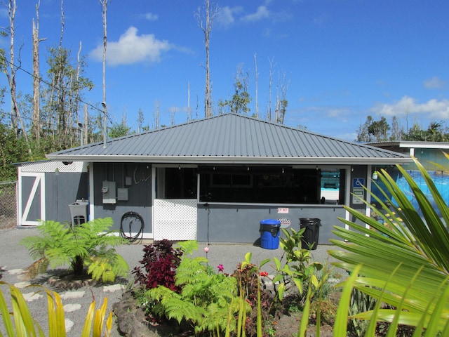 exterior space with metal roof