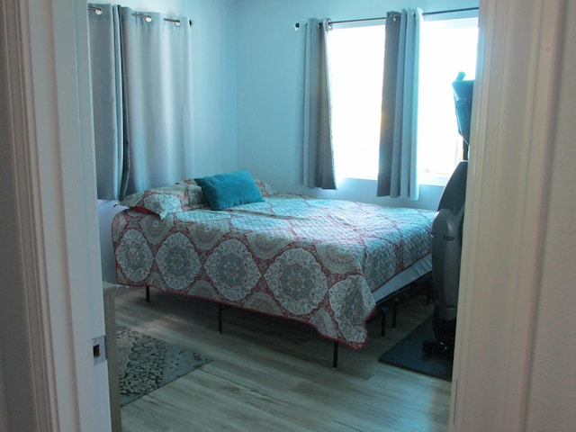 bedroom featuring wood finished floors