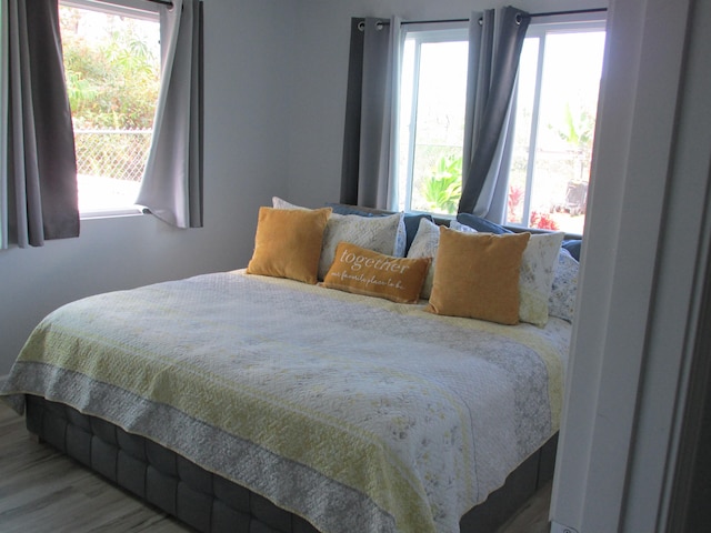 bedroom with wood finished floors