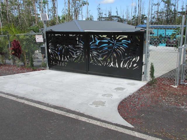 view of gate with fence