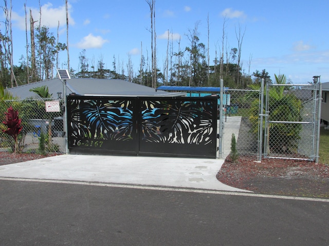 view of gate with fence