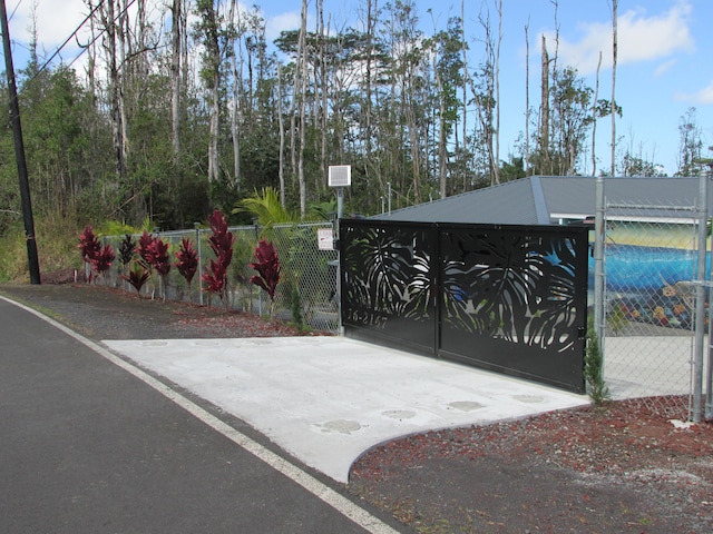 view of gate featuring fence