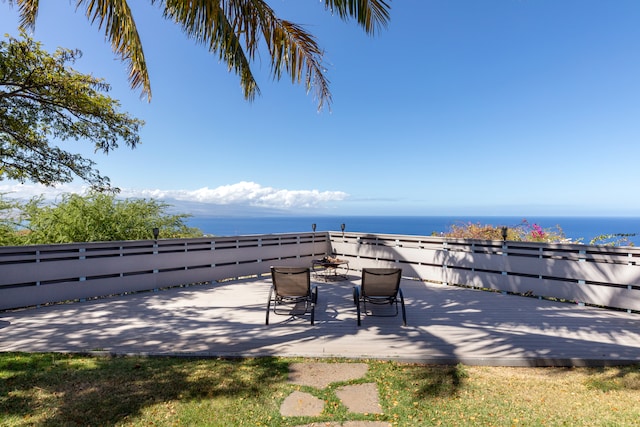 view of patio featuring a deck with water view
