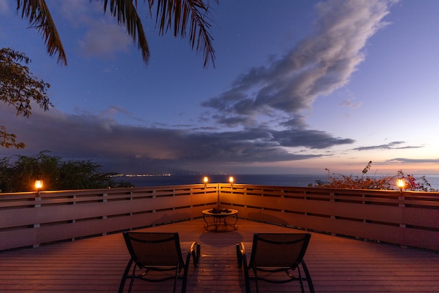 wooden deck featuring a water view