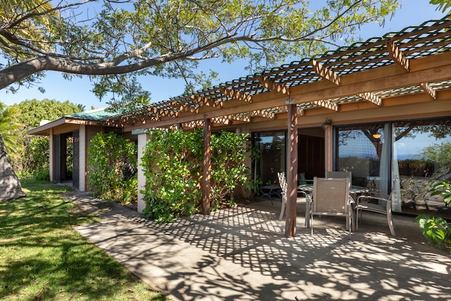 view of patio with a pergola and outdoor dining space