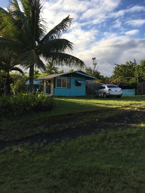 view of home's exterior with a yard and stucco siding