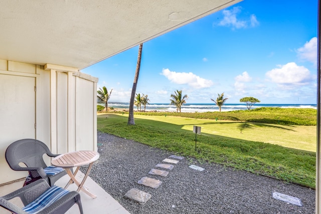 view of patio with a water view