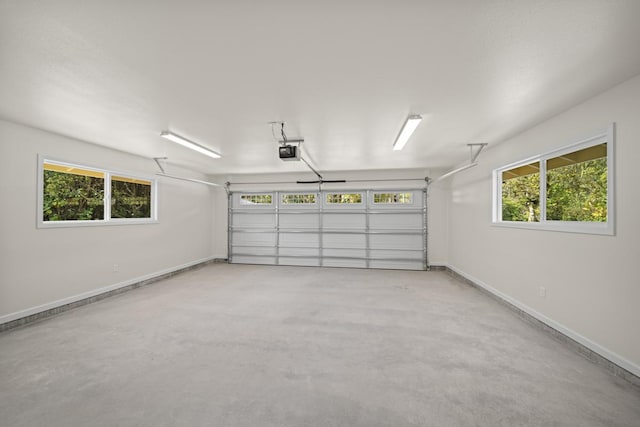 garage featuring baseboards and a garage door opener