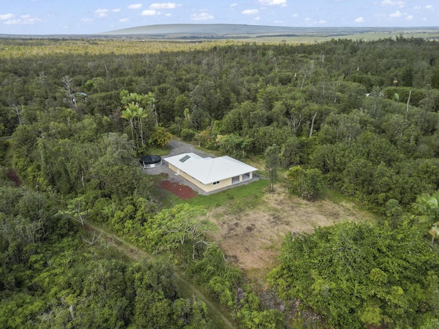 aerial view featuring a wooded view