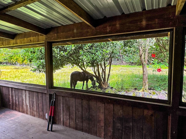 unfurnished sunroom with a wealth of natural light