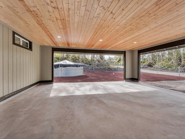 interior space with wooden ceiling, concrete floors, and recessed lighting