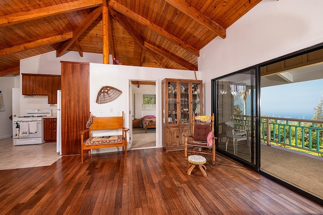 sitting room with dark wood-type flooring, wood ceiling, beamed ceiling, and high vaulted ceiling