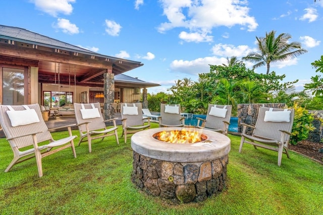 view of yard with an outdoor fire pit