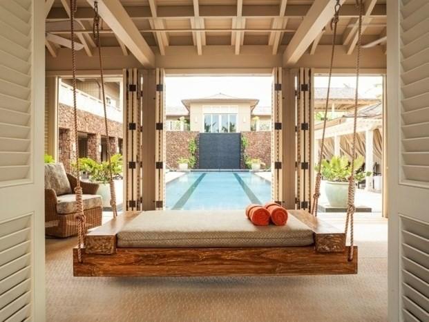 interior space featuring coffered ceiling, carpet flooring, and beam ceiling