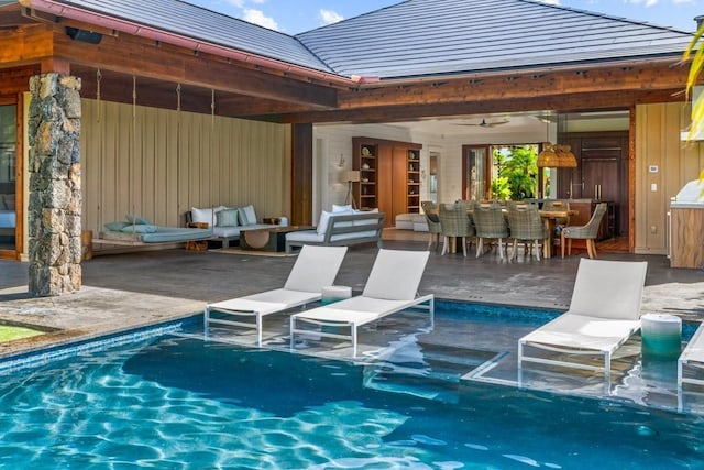 exterior space with a patio area, an outdoor pool, and outdoor lounge area