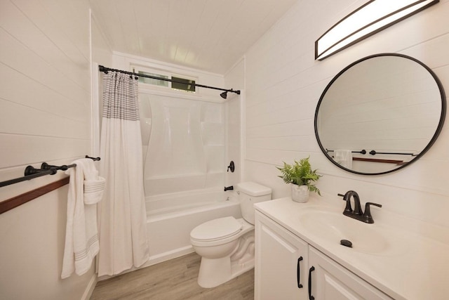 bathroom featuring vanity, wood finished floors, shower / bath combination with curtain, wood walls, and toilet