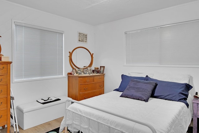 bedroom with wood finished floors