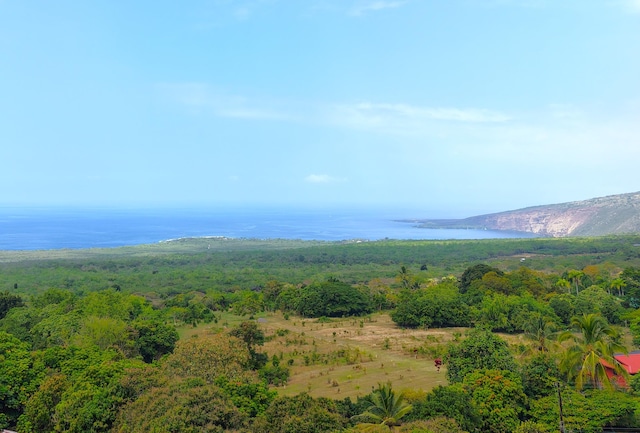 property view of mountains featuring a water view and a wooded view