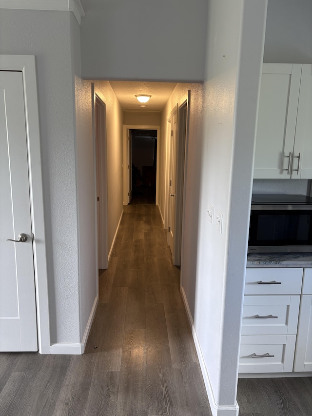 15-1509 22nd Ave, Keaau, HI 96749 - corridor with dark wood-type flooring and baseboards