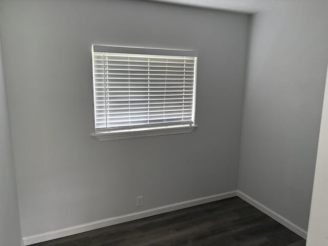 15-1509 22nd Ave, Keaau, HI 96749 - empty room featuring dark wood finished floors and baseboards