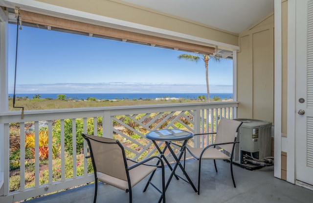 balcony featuring a water view