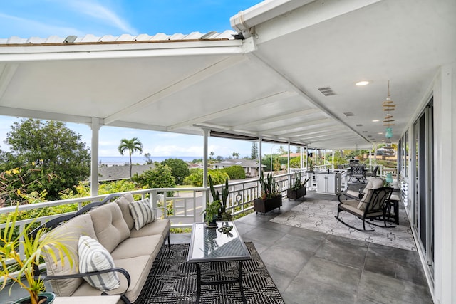 view of patio featuring visible vents, outdoor lounge area, and a balcony