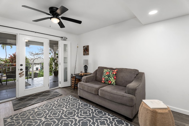 living area featuring recessed lighting, baseboards, a ceiling fan, and dark wood-style flooring