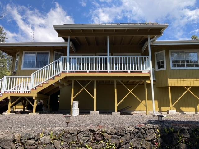 back of house with stairway